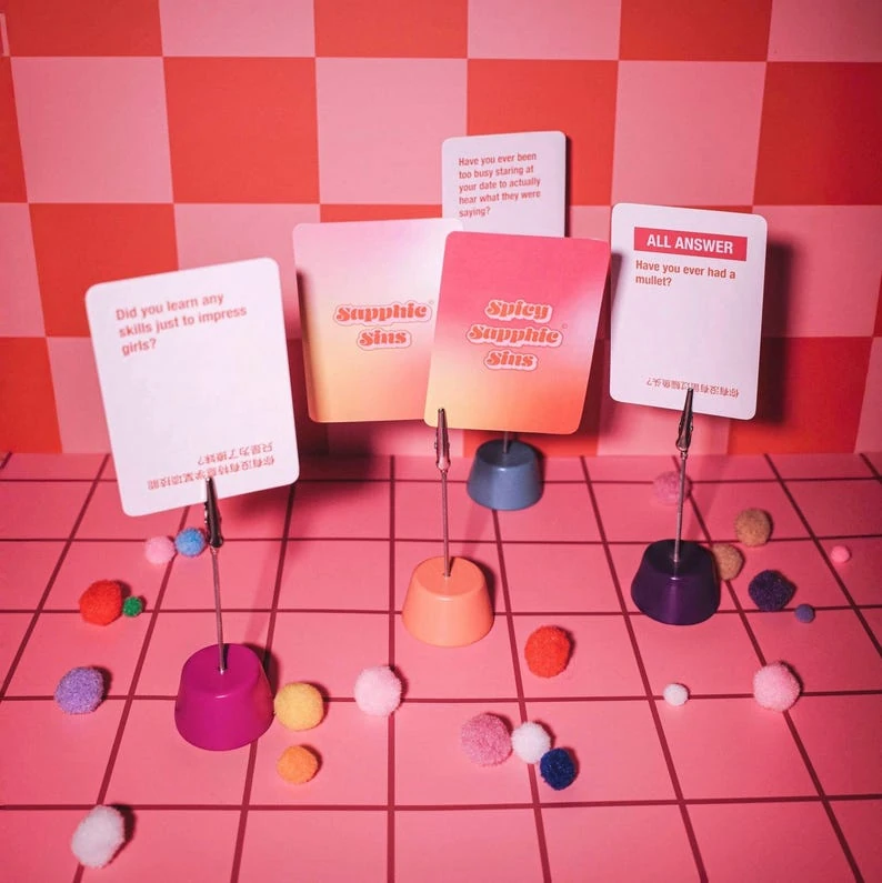 Sapphic Sins question cards displayed in colorful clips